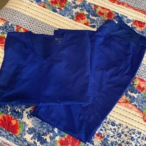 Blue scrub set by EON. Size XL.